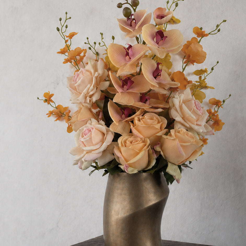 Purple, pink and white artificial flower stems arranged together